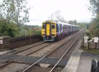 The view from the north end of Settle's Up platform as 158755, more usually to be found on Blackpool York services, sets off for Carlisle, next stop Horton-in-Ribblesdale. Note the <I>LOCO STOP</I> notice, an unusual feature nowadays, situated part way across the bridge to assist in getting coaches to fit into the short Settle platforms.<br><br>[Mark Bartlett 23/10/2010]