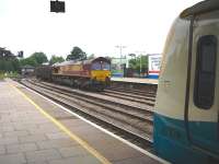 66137 enters Hereford station from the south on 10 June with a steel working. The freight will shortly pass an ATW 175 at the opposite platform waiting to depart on the 14.12 service to Cardiff.<br><br>[David Pesterfield 10/06/2010]