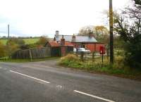 Entrance to the former Ewesley station (1870) on the Northumberland Central Railway on 31 October 2010. Closed to passengers in 1952, the refurbished station master's house looks in fine fettle with the rain glistening on the roof. Just off to the left are the surviving abutments of the bridge which carried the branch across the road and on to the junction with the Wansbeck line at Scotsgap. The Rothbury branch was closed completely in 1963.<br>
<br>
<br><br>[John Furnevel 31/10/2010]