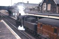 Standard Class 2 2-6-0 no 78047 with the branch train at Kelso in April 1962 preparing to return to St Boswells. Kelso station lost its passenger service in 1964, with the line from Kelso Junction closing 4 years later.<br><br>[Frank Spaven Collection (Courtesy David Spaven) /04/1962]