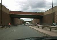 The LNWR route from Three Spires Junction to Humber Road Junction has been converted to a road (Phoenix Way), but with brick cutting walls and frequent overbridges its origins are clear. Notice the human-powered 1-1-0 on the left.<br><br>[Sally Strachan 13/06/2010]