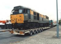 A droop - nosed and partially stripped 31159 at rest on the Woolley Edge northbound service area on the M1 on its final journey on 6 June 1996. The locomotive was cut up at MC Metals, Springburn, later that month. <br><br>[David Pesterfield 06/06/1996]