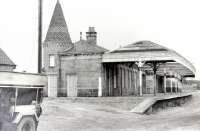 Scene at Aboyne station in 1975, some 9 years after closure, looking east towards Aberdeen. The canopy and platform have now gone, but the attractively refurbished station building survives today as part of a shopping complex [see image 5837 for the same view thirty years on].<br><br>[Colin Miller //1975]