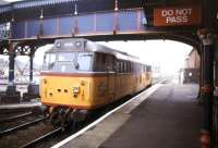 Locomotive 31116 in 'BR Research' Colours runs through March station in September 1994.<br><br>[Ian Dinmore /09/1994]