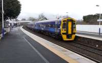 One two-car 158 unit normally suffices for the hourly Perth - Edinburgh semi-fast, but on Saturday 20 November there is a rugby <br>
international at Murrayfield and a six car train is deemed necessary on this occasion. The formation is seen here leaving Inverkeithing at 11.58 with a suitably patriotic-looking 158 870 leading. <br><br>[David Panton 20/11/2010]