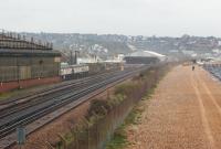 Looking east along the coast towars St Leonards, with the Southern trains depot immediately to the left and the Southeastern trains depot (the more modern looking shed) in the middle distance. Immediately to the right of the shingle is the English Channel on a dull, wet and blustery 27th of October 2010.<br>
<br><br>[John McIntyre 27/10/2010]