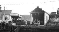 The terminus of the Northumberland Central Railway at Rothbury, seen from the buffer stops at the north end of the turntable via which visiting locomotives accessed the shed on the right after running through the station. The photograph was taken on 9 November 1963 during a visit by the RCTS/SLS <I>Wansbeck Wanderer</I> railtour. [See image 32180]<br><br>[K A Gray 09/11/1963]