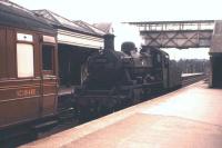 Standard Class 2 2-6-0 no 78047 with the empty stock of the Kelso branch train at St Boswells in April 1962. [See image 31572]<br><br>[Frank Spaven Collection (Courtesy David Spaven) /04/1962]