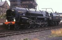 Portrait of power - 92220 <I>Evening Star</I> is now a static National Collection exhibit but in the 1970s was steamed on both the main line and various preserved railways. Here it is seen taking water at Keighley, whilst in use on the Worth Valley Railway, prior to another run up the five mile branch to Oxenhope. <br><br>[David Hindle //1976]