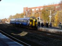 156.511 about to depart with the 10.49am to Carlisle with the 'doomed' Johnnie Walker building in the background.<br><br>[Ken Browne 26/11/2010]