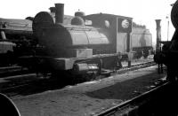 Scene in the shed yard at 26B Agecroft in March 1963 with Aspinall 0-4-0ST <i>Pug</i> no 51232 centre stage. The original L&Y eight road straight shed here was officially closed in October 1966 and demolished two years later. [With thanks to Vic Smith]<br><br>[K A Gray 23/03/1963]