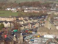 Clitheroe station, as seen from the ramparts of the Norman keep. The original building, now an art gallery, is in the centre of the picture and the replacement booking office can just be seen to its right. For the view from the station up to the castle [See image 30769]<br><br>[Mark Bartlett 27/11/2010]