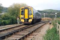 The 1203 service from Kyle of Lochalsh about to join the route from Wick and Thurso at Dingwall Junction on 1 October 2009 on its way to Inverness. Photograph taken from alongside the public foot crossing.<br><br>[John Furnevel 01/10/2009]