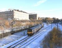 320 320 comes off the Springburn branch at Bellgrove Junction with a <br>
Dalmuir service on 27 November. This is the site if the collision in 1989 [see image 20555] in which two people died. The tracks going off to the right are for Airdrie (and now Edinburgh).<br>
<br><br>[David Panton 27/11/2010]