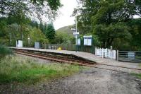 The 'road' approach to Achnashellach station from the north in September 2009 with the foot-crossing much used by walkers.<br><br>[John Furnevel 29/09/2009]