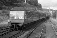 The former 'Devon Belle' observation car at the rear of the mid-morning Inverness-Kyle train as it pulls out of Garve in the summer of 1967. The overbridge in the background (carrying the Inverness-Ullapool road) has since been replaced by a level crossing.<br>
<br><br>[Frank Spaven Collection (Courtesy David Spaven) //1967]