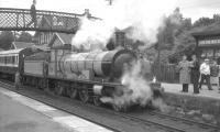 The preserved ex-Highland Railway <I>Jones Goods</I> 4-6-0 no 103 poses for photographs while taking on water at Blair Atholl on 30 August 1965. The locomotive was returning south with the pair of preserved ex-Caledonian Railway coaches forming the 1.35pm Inverness - Perth special. The combination had spent the previous week operating in the Inverness area as part of the Highland Railway Centenary celebrations.<br><br>[K A Gray 30/08/1965]