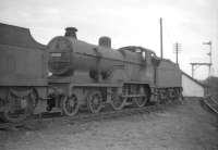 Fowler 2P 4-4-0 no 40606 stored at 67D Ardrossan shed in March 1959. Officially withdrawn by BR two months later, the locomotive was cut up at Inverurie works at the end of September that year.<br><br>[Robin Barbour Collection (Courtesy Bruce McCartney) 27/03/1959]