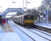 I've just alighted with my fellow travellers from the Maryhill Line <br>
service arrived at Platform 3 on 27 November. It was a 158 so it was a relief to get out into the comparative warmth of the open air. On Platform 2 (yes, the numbers are in the wrong order) 318 258 pulls in with a Dalmuir service.<br><br>[David Panton 27/11/2010]