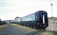 New Swindon class 126 DMU trailer cars, standing behind Lugton Signal Box alongside the loading bank, during a break in their journey from Swindon Works to Glasgow's Eastfield depot in the summer of 1959. Car no Sc59407 is nearest the camera. [See image 39297]<br>
<br>
<br><br>[A Snapper (Courtesy Bruce McCartney) /08/1959]