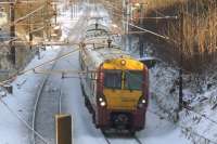 334036 passing through Elderslie on 2nd December as it slows on it's approach to Johnstone station<br><br>[Graham Morgan 02/12/2010]