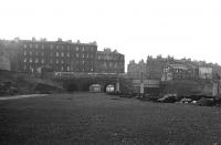View west showing the bridges that carried Morrison Street and Gardners Crescent over the Caledonian route into Lothian Road goods depot and the adjacent Princes Street station. The year is 1972 and by this time all track has been lifted and most of the site cleared. [See image 29568 for the view east from the other side of the bridges at this time.] <br><br>[Bill Jamieson //1972]