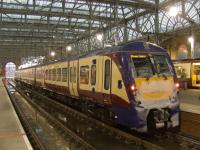 334012 is the next Class 334 unit to receive the new Scotrail blue livery. Here it stands at Platform 13 of Glasgow Central, having arrived from Wemyss Bay, partially vinyled at the ends and rubbed down in preparation for the new coat to be applied.<br><br>[Graham Morgan 06/12/2010]