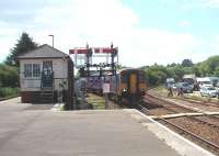The Newquay train emerges from the stabling siding into Platform 3 at Par. 150248 is just passing the signalbox and lower quadrant semaphores. Trains from this platform can either turn right towards St Blazey and Newquay or left to access the main line. View west towards St. Austell.<br><br>[Mark Bartlett 15/06/2010]