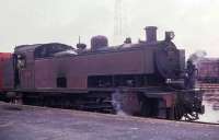 North Britsh Loco 4-8-4T No. 1305 shunting at Nairobi during the last few months of regular steam working in Kenya. I understand the loco had been built in Glasgow as a 4-8-2T and was later converted. Sister engine 1315 apparently went to the Nariobi Railway Museum but its current status is uncertain - more information welcomed. <br><br>[David Hindle //1978]