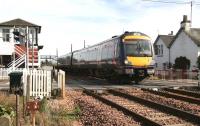 A morning Dundee - Edinburgh Waverley service runs over the level crossing at Errol in November 2006.<br><br>[John Furnevel 15/11/2006]