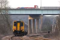 156421 heads west from Gathurst on 2 March 2010 with a service to <br>
Southport, contrary to what the destination board at the back of the unit suggests. The service is about to cross the Leeds - Liverpool Canal and then pass below the Gathurst viaduct carrying the M6 motorway.<br>
<br><br>[John McIntyre 02/03/2010]