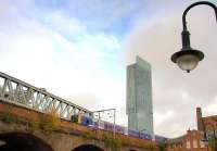 A train crosses Manchester's Castlefield Viaduct in September 2009. In the background stands the 47-storey Beetham Tower, the tallest building in the UK outside London.<br><br>[Ian Dinmore 28/09/2009]