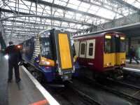 380001 (attached to 380102) photographed at Glasgow Central with the 1530 Glasgow-Ayr service on 10 December 2010<br><br>[John Yellowlees collection 10/12/2010]