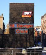 The 'tower' of St Georges Cross Subway station with the shadow of <br>
leafless trees in low sunshine on 27 November. This feature appears to be only decorative or to draw attention to the station. There are no lifts on the Subway and it seems a little big for the water tank for the staff WC!<br><br>[David Panton 27/11/2010]