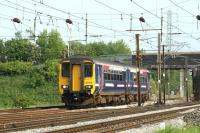 156452 heads south on the Up Slow lines at Farington Junction with a <br>
service for Manachester Victoria on 25 May 2009. A close examination of the front gangway door suggests someone has been taking pot shots at it!<br>
<br><br>[John McIntyre 25/05/2009]