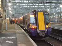 380001 stands at Platform 15 and is the rear unit of the terminated 0742 Largs - Glasgow Central. Although now being used in service, the Class 380 continues to have teething problems and the class is not yet ready for full operation as hoped.<br><br>[Graham Morgan 13/12/2010]