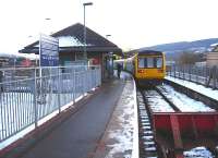 142074 and a sister unit wait at the platform at Merthyr Tydfil terminus to form the 16.08 service to Barry Island on a chilly 9 December 2010.<br><br>[David Pesterfield 09/12/2010]