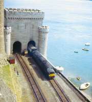 A class 40 skirts Conwy Castle in the 1970s with a train for Holyhead.<br><br>[Jim Peebles //]