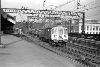 A 303 leaves Glasgow Central on 15 February 1967 displaying the less than helpful destination <I>Glasgow</I>.<br><br>[Colin Miller 15/02/1967]