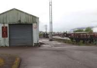 Early morning steam raising at Fort William depot. 5MT 4-6-0, 45231, is being prepared for the <I>Jacobite</I> service to Mallaig while 45407, on the adjacent siding, is spare loco. View towards Fort William from the depot entrance gates.<br><br>[Mark Bartlett 19/05/2010]