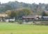 Bodiam station on the Kent & East Sussex Railway viewed south <br>
across the valley from the National Trust run Bodiam Castle on 29 October 2010. Ex-GWR 0-6-0PT no 1638 is in the process of running round the train it has recently brought in from Tenterden Town.<br>
<br><br>[John McIntyre 29/10/2010]