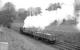 <I>Careful with that!</I>  0-4-0ST <I>Dailuaine</I>, seen here in charge of a precious cargo near the Dailuaine distillery between Carron and Aberlour on the Speyside line in the 1960s.<br><br>[Robin Barbour Collection (Courtesy Bruce McCartney) //]