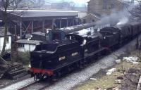 Midland 4F 0-6-0 43924 and WC 4-6-2 34092 <I>City of Wells</I> emulate the S&DJR <I>Pines Express</I> as they double head a service on the Worth Valley. The pair are running in to Haworth from Oxenhope past the goods shed workshops and Haworth yard.<br><br>[David Hindle //]