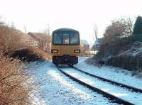 The Christmas Eve <I>Boat Train</I> has just accessed the Heysham branch and heads for the port to connect with the Isle of Man sailing. The small amount of snow that had fallen the Friday before had certainly lingered. 144007 has just passed the boarded crossing that marks the junction with the old direct line to Lancaster Green Ayre. <br><br>[Mark Bartlett 24/12/2010]