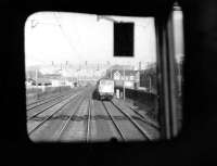 The view from the front of an AM10 (Class 310) EMU heading through Queens Park towards Euston in March 1976 passing a Class 87 on its way north towards Watford Junction.<br><br>[John McIntyre 20/03/1976]