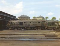 NBL Type 2 no D6136 standing in the shed yard at Eastfield in 1967. The locomotive appears to have suffered more than a slight bump. Standing beyond is D5118, a visitor from 60A Inverness. D6136 was the first of the class to be scrapped, being cut up by Barnes & Bell at Coatbridge in April 1968.<br><br>[Jim Peebles //1967]