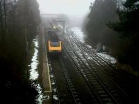 HST's in the mist - and not a Sigourney Weaver to be seen. It is refreshing to find a small country station with about 3 trains an hour each way. The train on the right is the 14.50 to Didcot Parkway and that on the left, the 14.30 to Cheltenham Spa - which is running rather late. Notice that the engineer's siding, once part of the GWR Cirencester branch, has its own headshunt!<br><br>[Ken Strachan 29/12/2010]