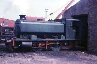 The last day of rail operations at Millom Ironworks sees Barclay<br>
0-4-0ST No.1 (Works No. AB 2333/1953) standing outside the locomotive shed. Now preserved on the Lakeside & Haverthwaite Railway as <I>'David'</I> it still carries that fine looking number plate. The loco shed, built in 1944, is still in use as a factory making nylon brush bristles. (Thanks to Chris Moore for additional information.)<br><br>[David Hindle 19/09/1968]