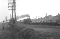 The way it used to be... watching the trains go by at Hillington East in September 1965. A Fairburn runs through the station on the down fast line.<br>
<br><br>[Colin Miller 11/09/1965]