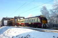 A Helensburgh - Edinburgh Waverley service, formed by 334 002, approaching Airdrie station on the afternoon of 22 December 2010.<br><br>[John Steven 22/12/2010]